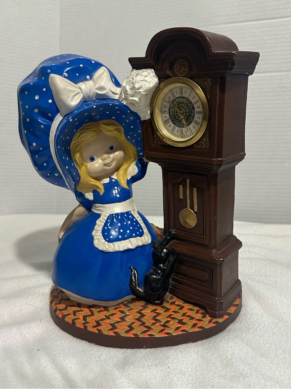 Blue Polka-Dot Girl Figurine with Brown Grandfather Clock Accent
